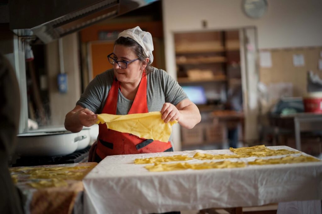 Italian woman making pasta from scratch