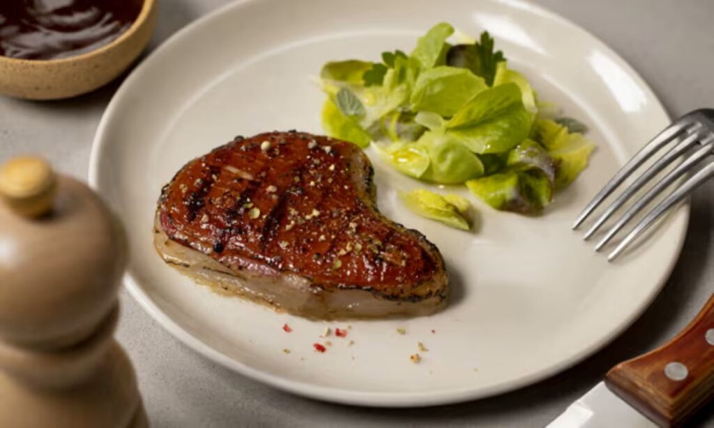 A piece of 3D printed steak on a plate