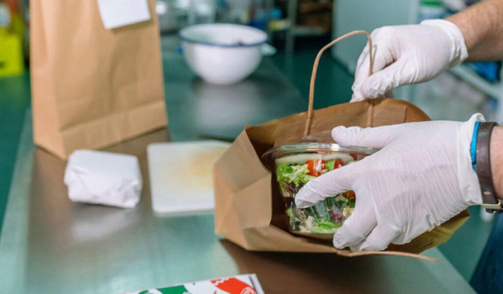 Packing take-away food in paper bags