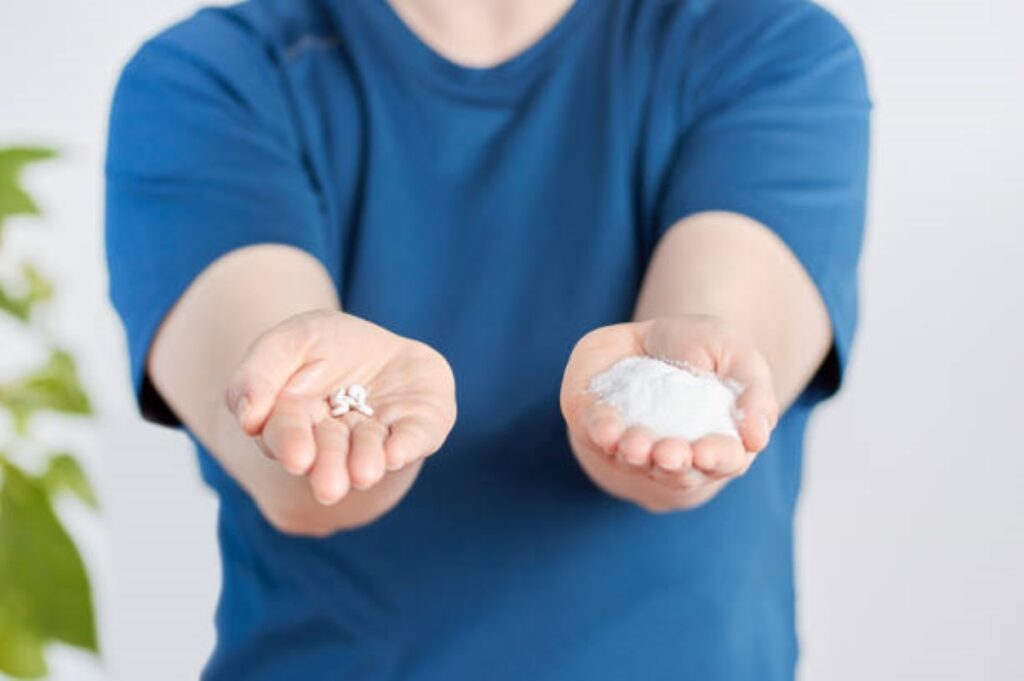 Front view close up of a woman hands holding sugar and saccharin