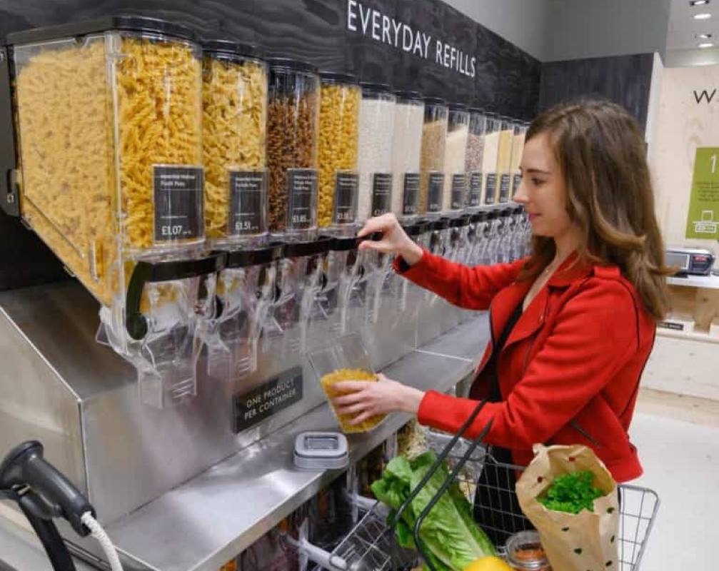 A woman refilling groceries at a store