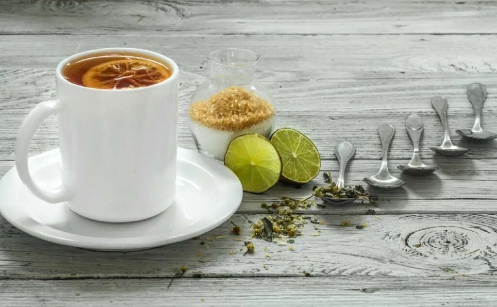 A cup of tea with a slices of lemon