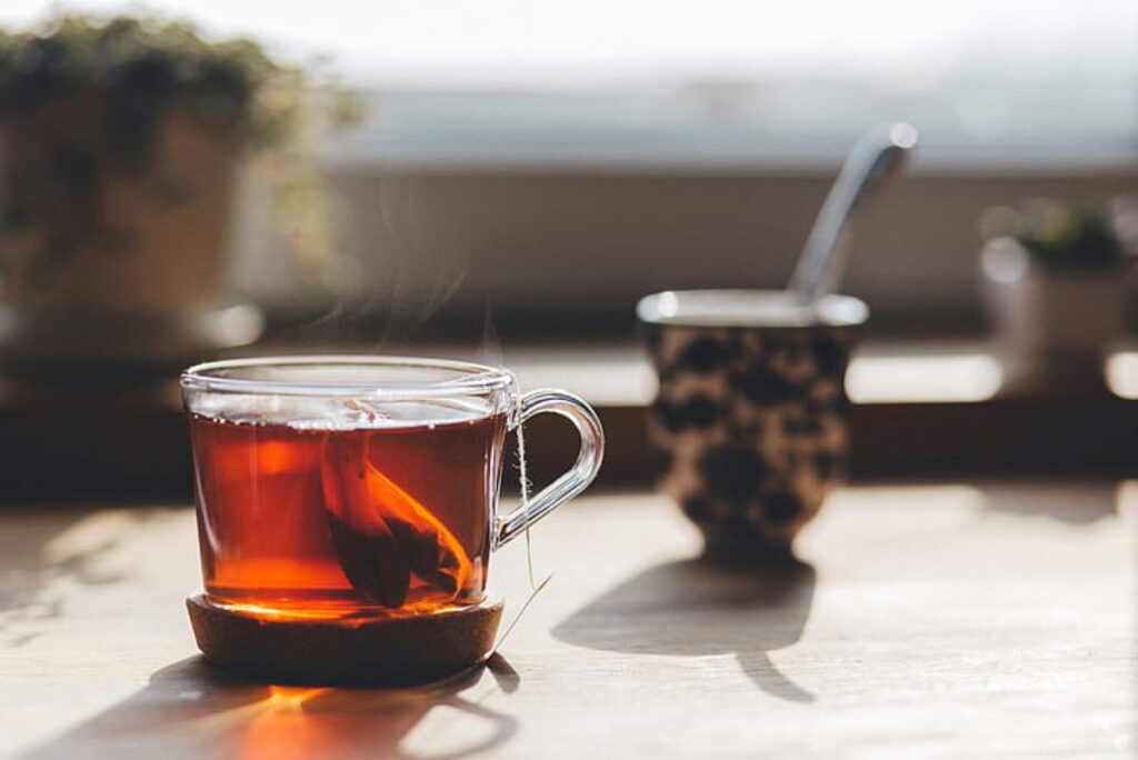 Close-up of clear glass teacup on top of table
