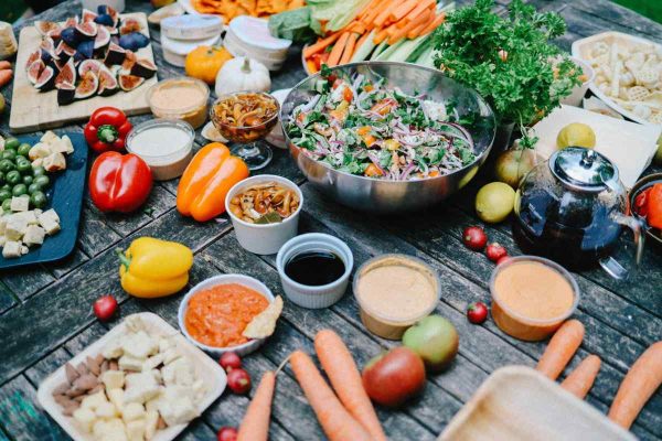 Exploring the Growing Market for Vegan and Plant-Based Products: A Taste of the Future Variety of Food on Wooden Table