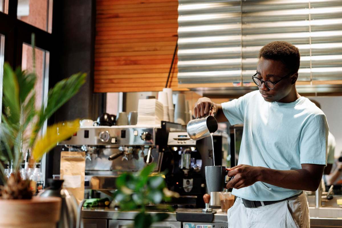 A man pouring himself a cup of coffee