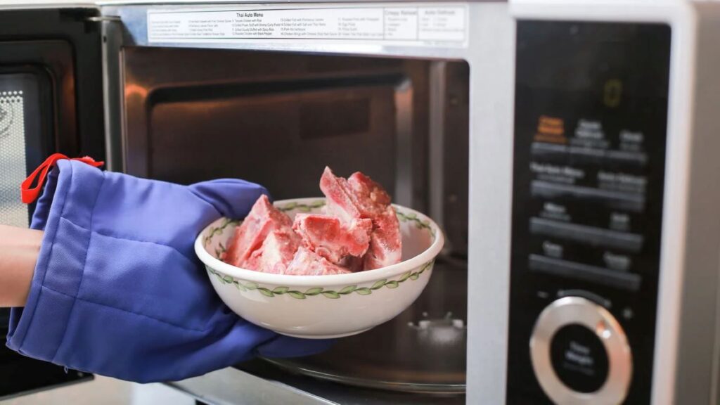 Midsection of a person preparing food in the kitchen