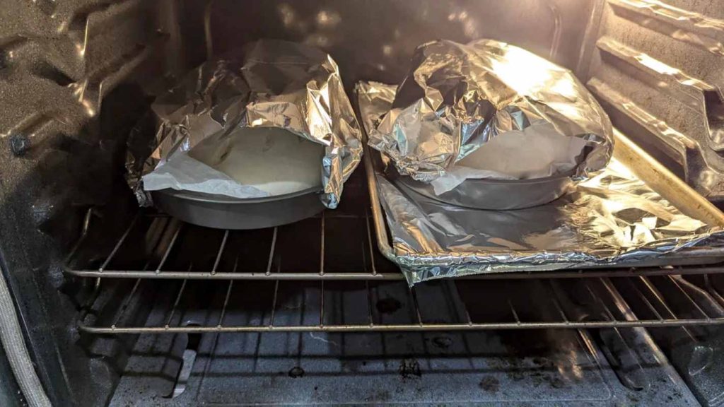 Aluminum foil as covering for sourdough bread in an oven 