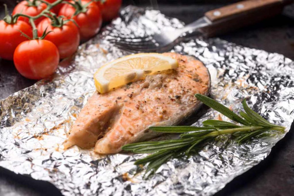 High view slice of fish and tomato