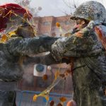 They battle using flour, eggs and firecrackers outside the city town hall as part of the celebrations of the Day of the Innocents, a traditional day in Spain for pulling pranks