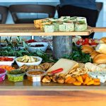 A picture displaying different types of food in open and closed containers