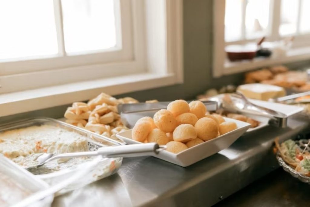 Platters of assorted appetizers and pastries on a buffet table